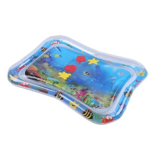 Baby playing on colorful summer inflatable water mat in backyard